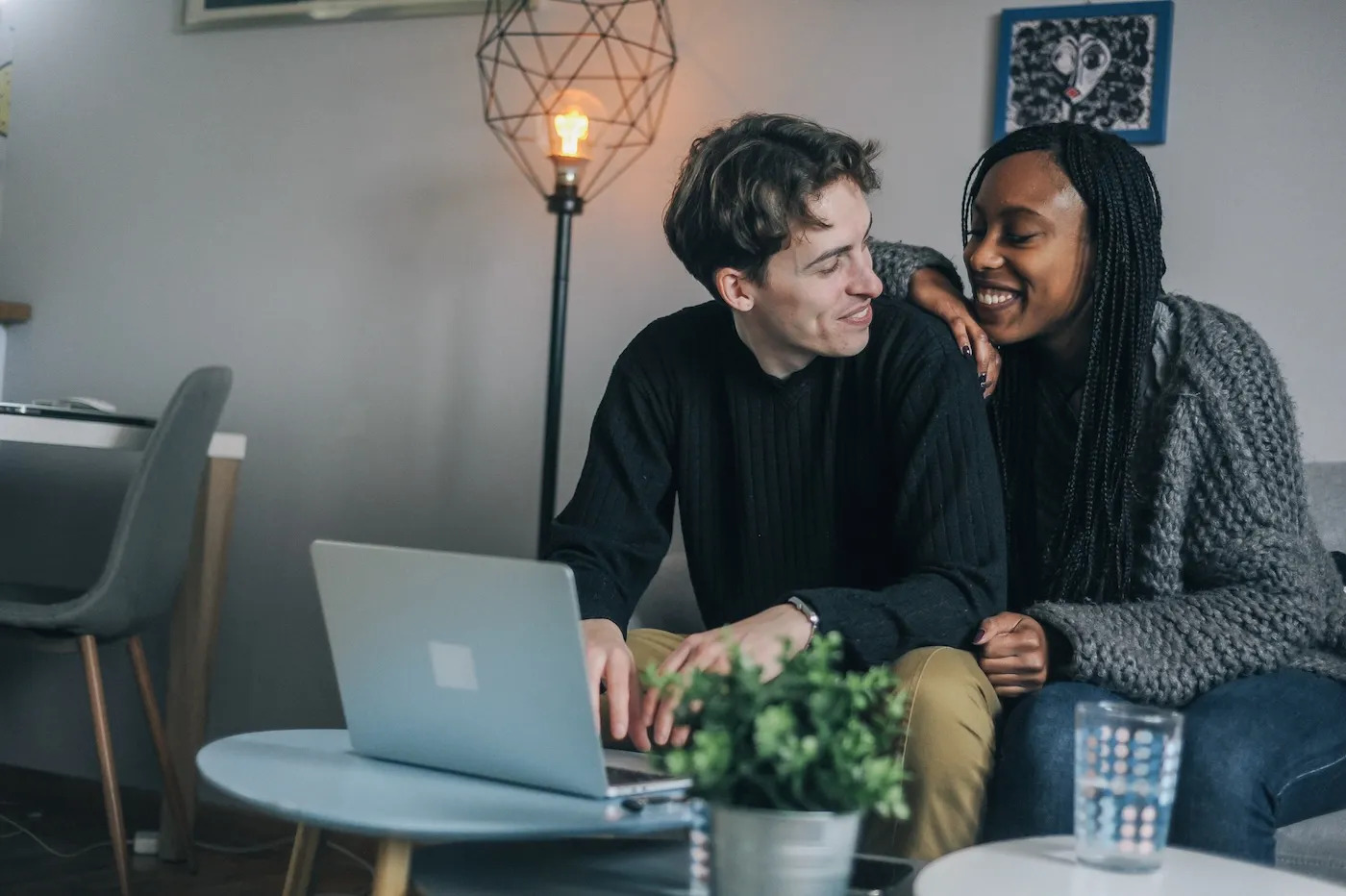 Couple reviewing mortgage pre-approval documents together at a table