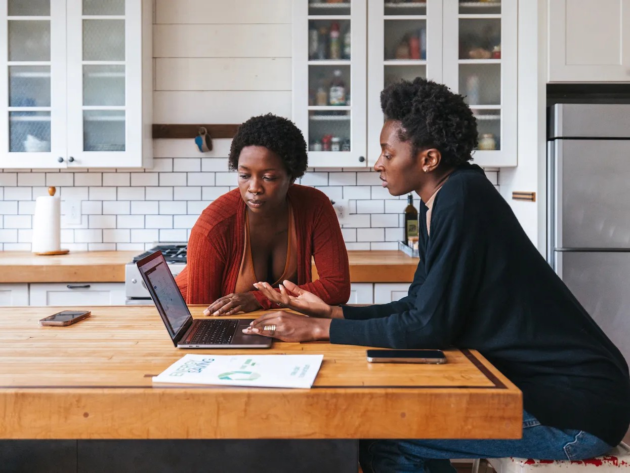 Couple researching mortgage options on laptop