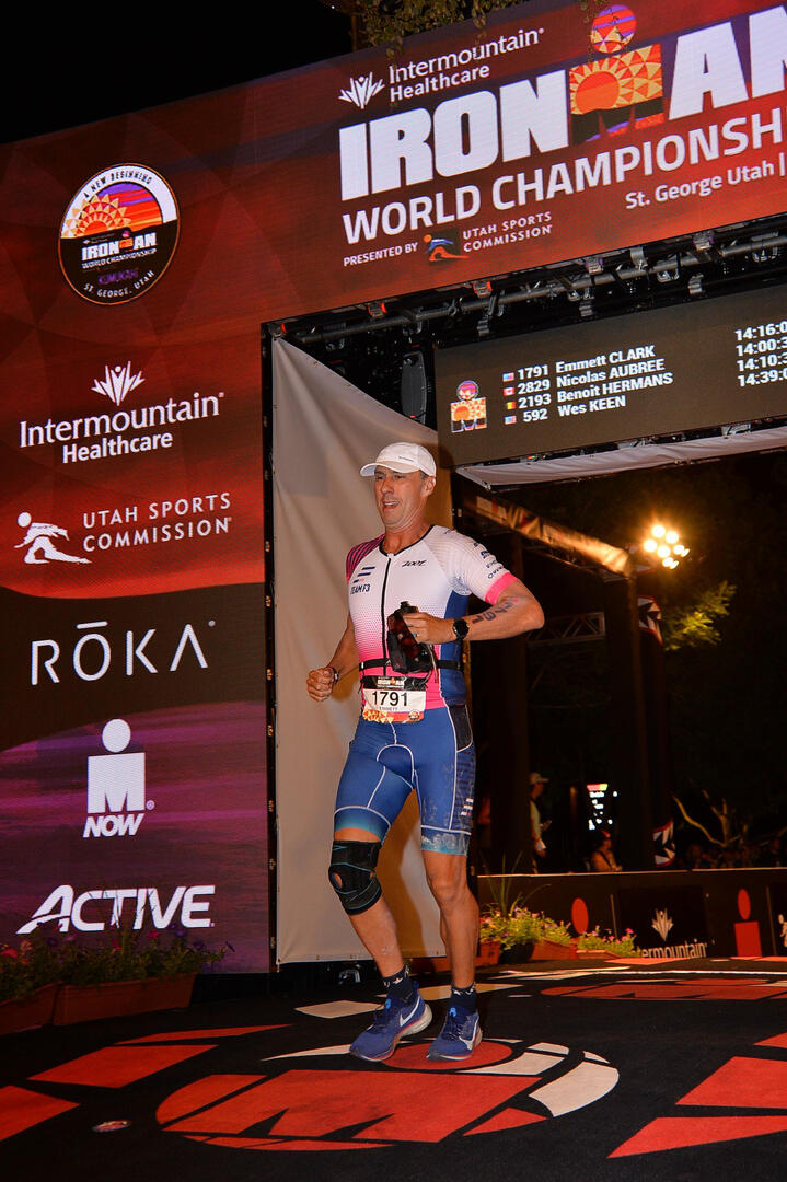 Emmett Clark crossing the finish line at the 2022 Ironman World Championships in St. George, Utah