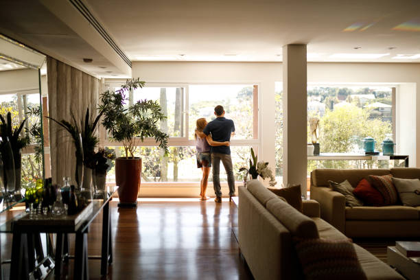 Couple in luxury home reviewing financing options