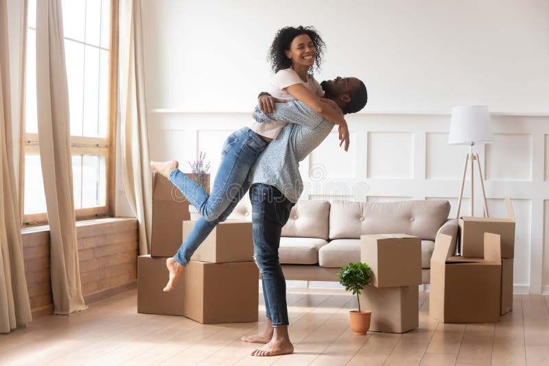 Happy first-time homebuyers with their new home
