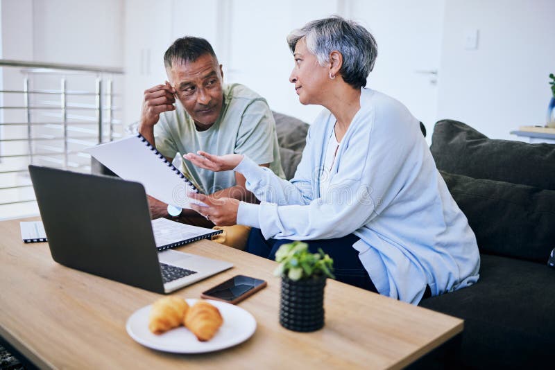 Couple reviewing refinancing options