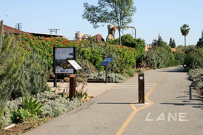 Whittier Greenway Trail paved walking and biking path with landscaping