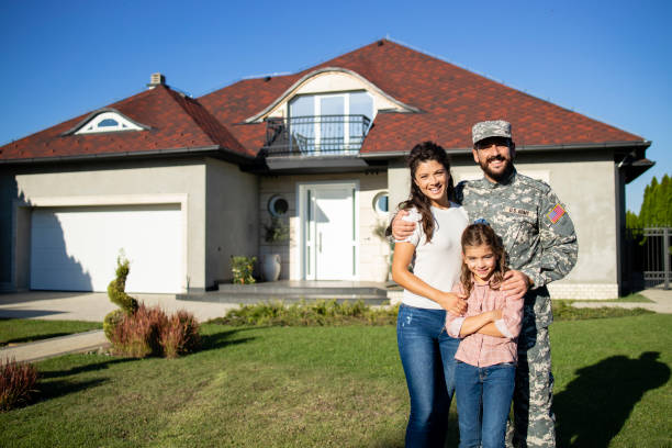 Utah military family in front of their home purchased with VA loan